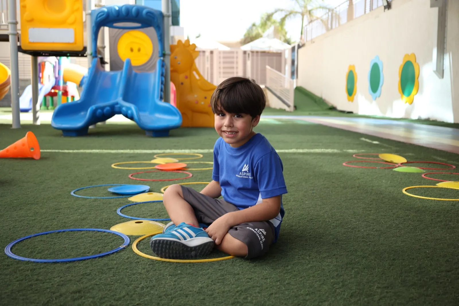 Children playing and learning outdoors on the Aspire campus